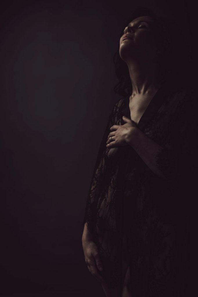 An example of stunning moody boudoir images done professionally in studio, by Loci Photography