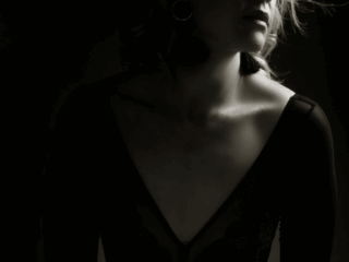 Black and white moody boudoir image taken in studio for a boudoir shoot done by Pretoria photographer Yolandi Jacobsz of Loci Photography