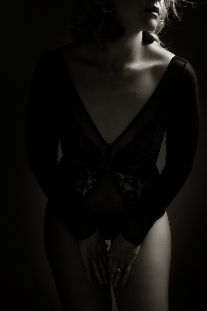 Black and white moody boudoir image taken in studio for a boudoir shoot done by Pretoria photographer Yolandi Jacobsz of Loci Photography
