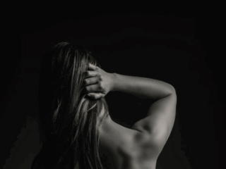 The gorgeous back shot taken during a professional boudoir shoot done in studio by Loci Photography.