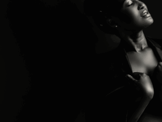 Black and white moody image taken in studio for a boudoir shoot done by Pretoria photographer Yolandi Jacobsz of Loci Photography