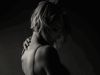 Black and white moody image taken in studio for a boudoir shoot done by Pretoria photographer Yolandi Jacobsz of Loci Photography