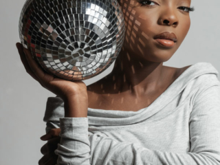 Young black girl doing a professional portfolio shoot in studio photographed by Loci Photography