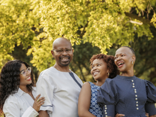 Beautiful laughing families during family photo sessions shot at the Pretoria Botanical Gardens by Loci Photography