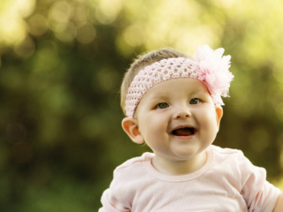 Baby laughing during lovely family photoshoot with Loci Photography