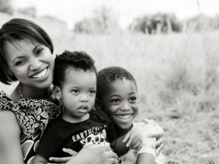 Image of smiling mommy and kids during a family photoshoot in Hartbeespoort by Loci Photography