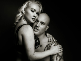 Black and white couple boudoir image taken in studio by photographer Yolandi Jacobsz of Loci Photography