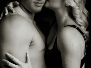 Black and white couple boudoir image taken in studio by photographer Yolandi Jacobsz of Loci Photography