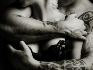 Black and white couple boudoir image taken in studio by photographer Yolandi Jacobsz of Loci Photography