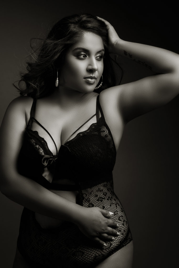 Black and white moody image taken in studio for a boudoir shoot done by Pretoria photographer Yolandi Jacobsz of Loci Photography