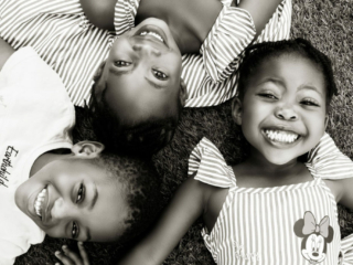 Smiling cousins during a family photoshoot done in Hartbeespoort by Loci Photography
