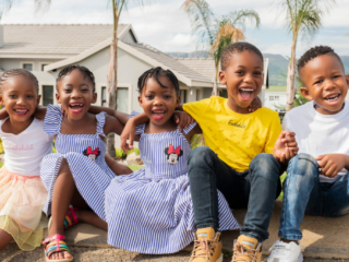 Smiling cousins during a family photoshoot done in Hartbeespoort by Loci Photography