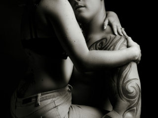 Black and white couple boudoir image taken in studio by photographer Yolandi Jacobsz of Loci Photography