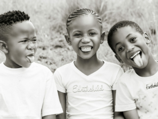 Smiling cousins during a family photoshoot done in Hartbeespoort by Loci Photography
