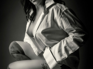 Making-magical-boudoir-shoots-happen-in-studio-by-Loci-Photography Black and white image of doing the ultimate professional boudoir experience in studio, by Loci Photography
