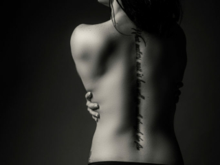 Professional-boudoir-photography-done-in-studio-by-Loci-Photography Black and white image of doing the ultimate professional boudoir experience in studio, by Loci Photography