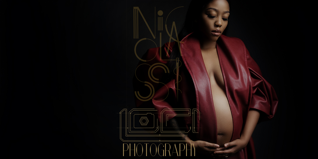 The red Nicolassi coat being used in a special way, during a maternity shoot with Loci Photography showing off the clothing range exclusive to Loci Photography