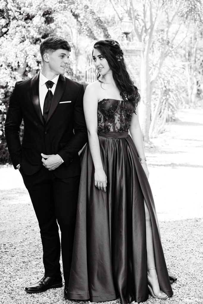 Black and white image couple during their matric dance photoshoot taken by Loci Photography
