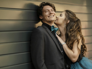 Image of couple laughing during their matric dance photoshoot by Loci Photography