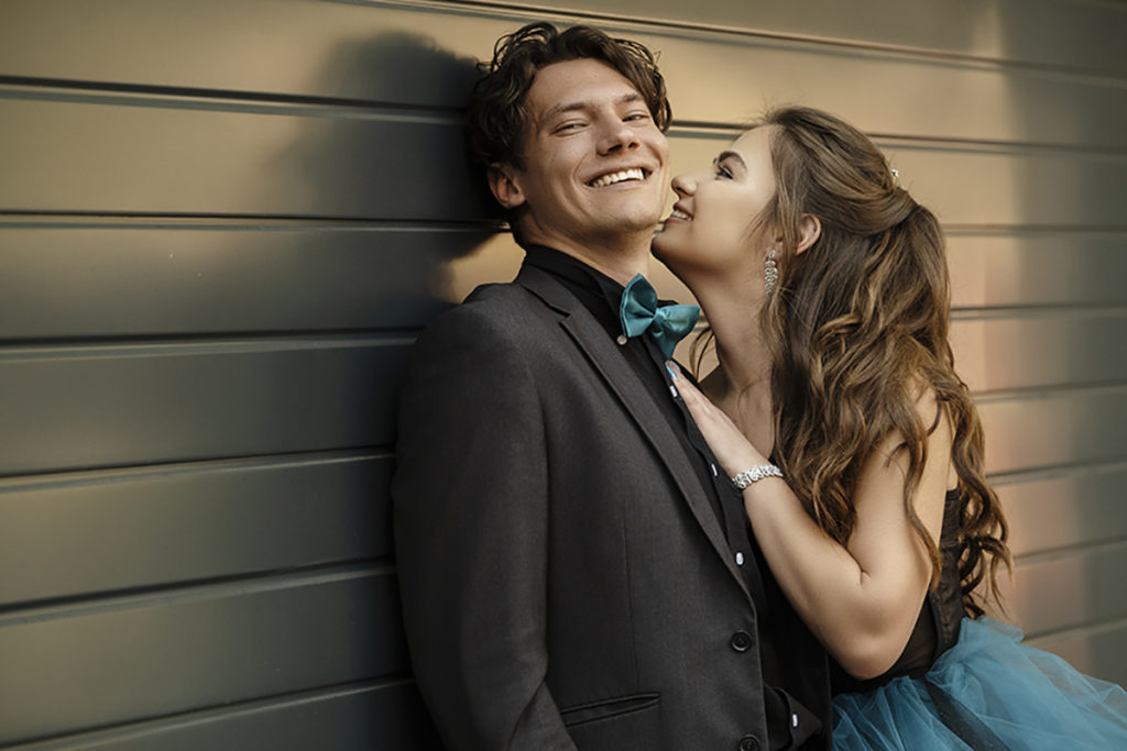 Image of couple laughing during their matric dance photoshoot by Loci Photography