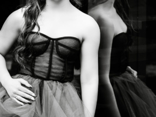 Black and white image of girl in dress taken at her matric dance shoot by Loci Photography