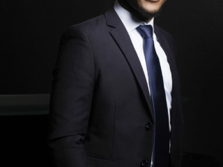 Image of man smiling in blue suit for corporate photography done professionally on location in Johannesburg by Loci Photography