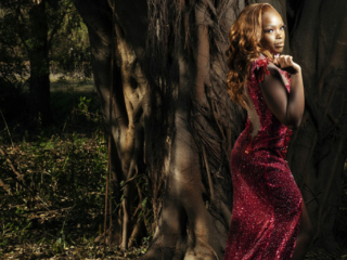 Image of young woman in dark pink glitter beaded dress taken at the Pretoria Botanical Gardens by Loci Photography