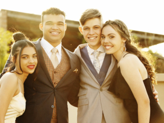 Image of group smiling in evening dress during their matric dance photoshoot by Loci Photography