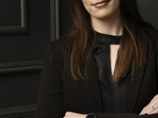 Image of corporate image taken in the Loci Photography studio with woman in black clothing