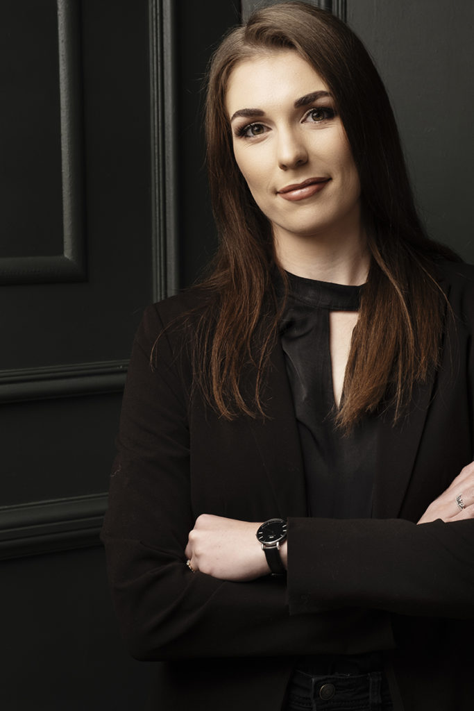 Image of corporate image taken in the Loci Photography studio with woman in black clothing