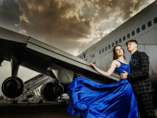 Image of blue dress blowing in the wind taken at Rand Airport in Germiston during a matric dance photoshoot by Loci Photography