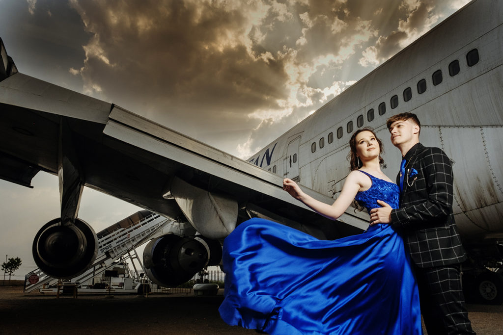 Image of blue dress blowing in the wind taken at Rand Airport in Germiston during a matric dance photoshoot by Loci Photography