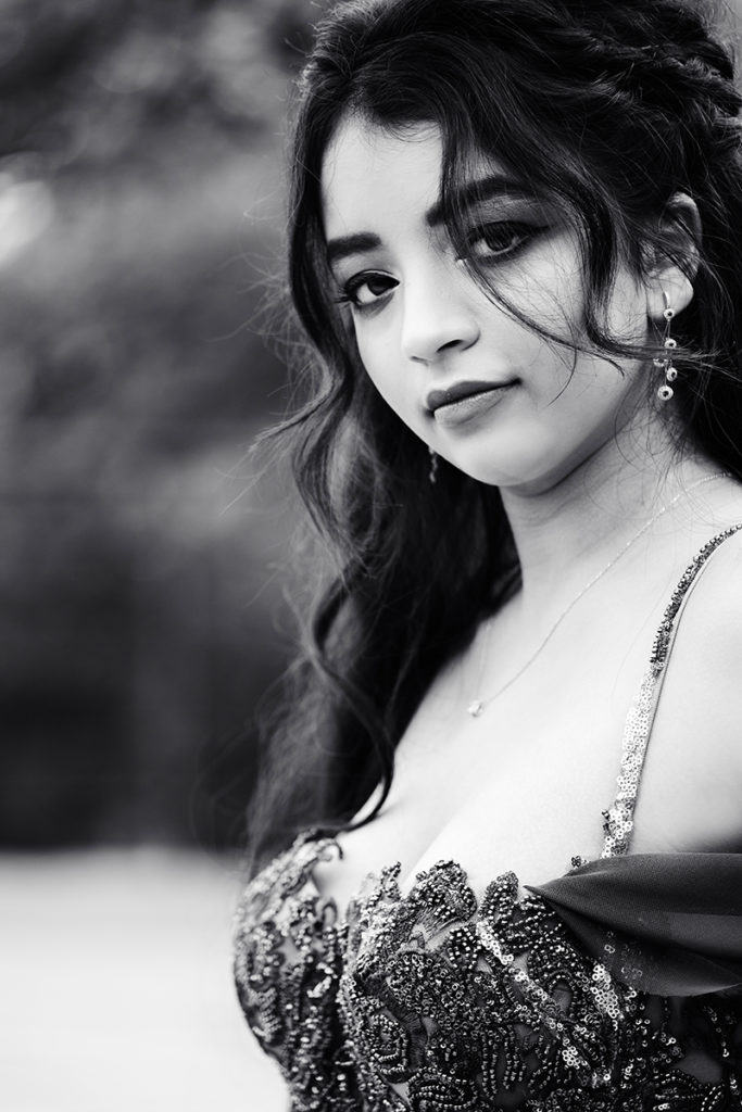 Black and white image of young woman during her matric dance photoshoot by Loci Photography