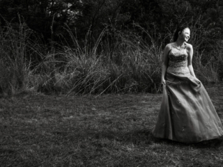 Black and white image of young woman and her dress during her matric dance photoshoot by Loci Photography