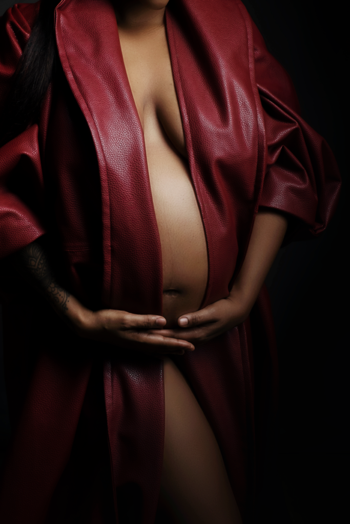 Image of using the red leather Nicolassi coat for a maternity shoot in the Loci Photography studio.