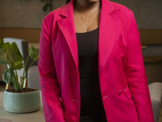 Image of woman smiling with pink jacket for corporate images on location in Johannesburg by Loci Photography