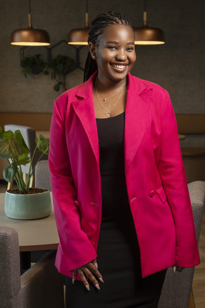 Image of woman smiling with pink jacket for corporate images on location in Johannesburg by Loci Photography