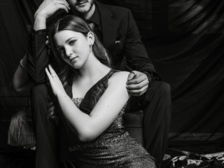Black and white image of young couple in studio taken for a studio matric dance shoot by Loci Photography