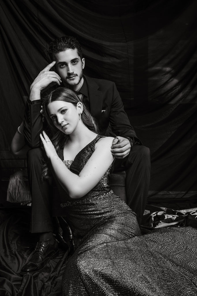 Black and white image of young couple in studio taken for a studio matric dance shoot by Loci Photography