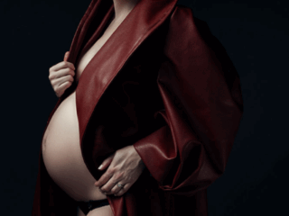 Stunning moody maternities using the red Nicolassi coat by Loci Photography.