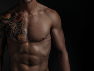 Moody fitness image of trained man with well shaped physique during fitness photoshoot with Loci Photography