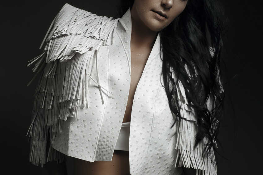 Handmade white fringe leather jacket by The Nicolassi Brand used during a studio boudoir shoot