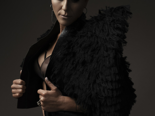 The best boudoir photography done by Loci Photography in Pretoria East showing a woman wearing a black jacket with short hair photographed in studio
