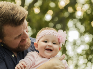 Laughing and smiling daddy and baby during their photoshoot with Loci Photography in Pretoria