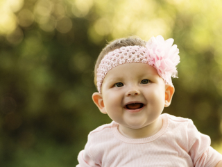 Laughing and smiling baby during their photoshoot with Loci Photography in Pretoria