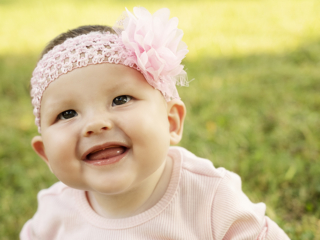 Laughing and smiling baby during their photoshoot with Loci Photography in Pretoria