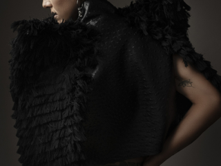 The best boudoir photography done by Loci Photography in Pretoria East showing a woman wearing a black jacket with short hair photographed in studio