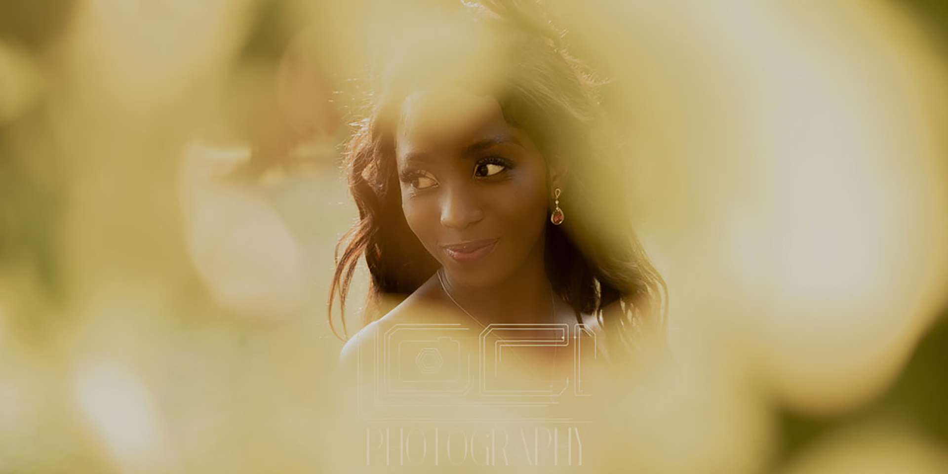 Stunning sunset matric dance images of girl looking through leaves by Loci Photography