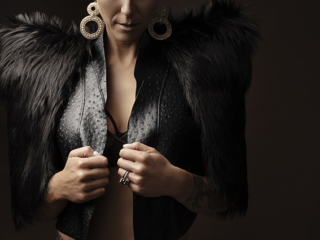 The best boudoir photography done by Loci Photography in Pretoria East showing a woman wearing a black jacket with short hair photographed in studio