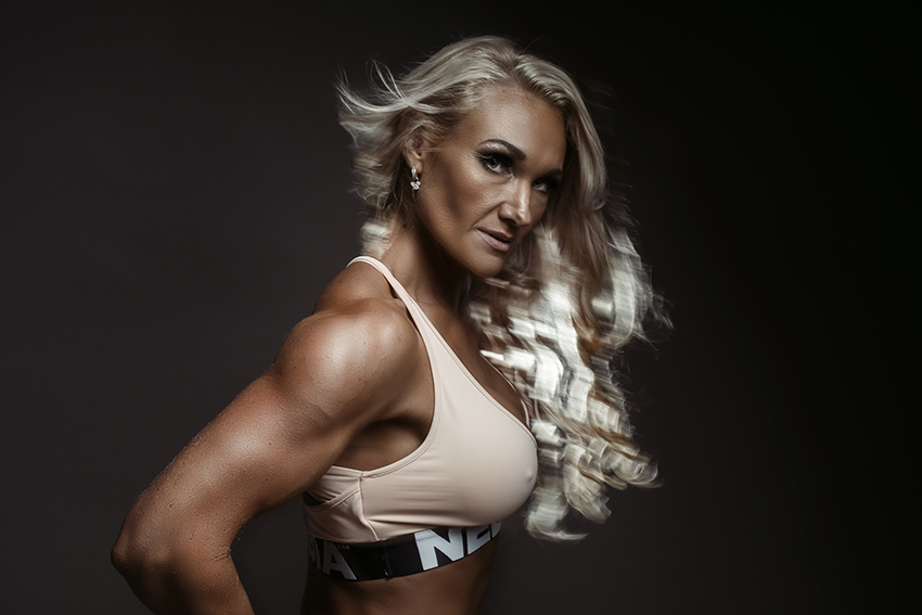 Dramatic image of fitness photoshoot with fit woman with blonde hair photographed by Loci Photography